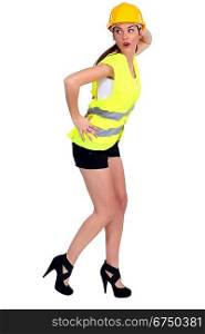 Female construction worker in shorts