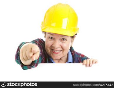 Female construction worker pointing at you over blank white space. Isolated design element.