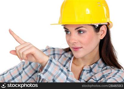 Female construction worker pointing her finger