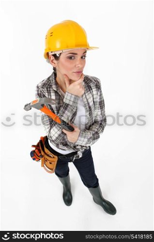 Female construction worker with a hammer