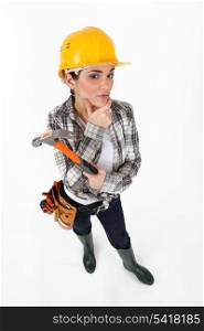 Female construction worker with a hammer