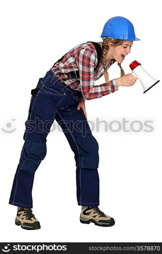 Female construction worker with a megaphone