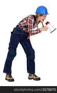 Female construction worker with a megaphone