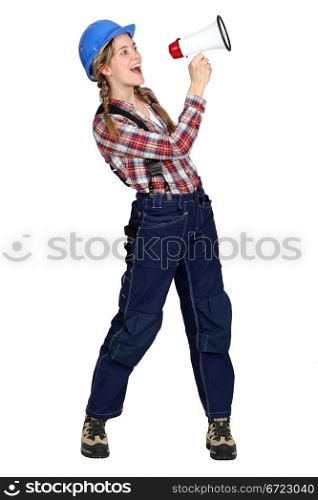 Female construction worker with a megaphone