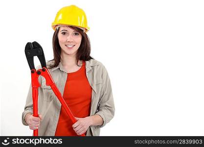 Female construction worker with boltcutters