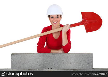 Female construction worker with mobile