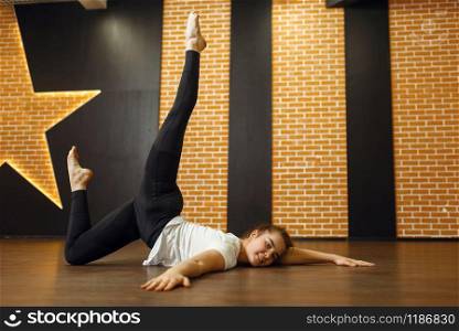 Female contemporary dance performer, body flexibility. Dancer on workout in class, modern ballet, elegance dancing, stretching exercise