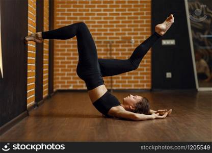 Female contemporary dance performer, upside down stretching exercise, women on workout in studio. Dancers training in class, modern ballet, elegance dancing. Contemporary dance performer, upside down exercise