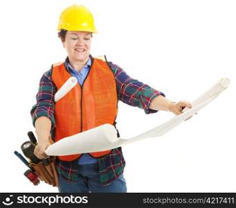 Female contractor examining blueprints. Isolated on white.