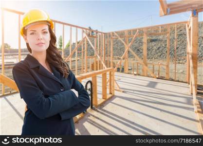 Female Contractor In Hard Hat At Construction Site.