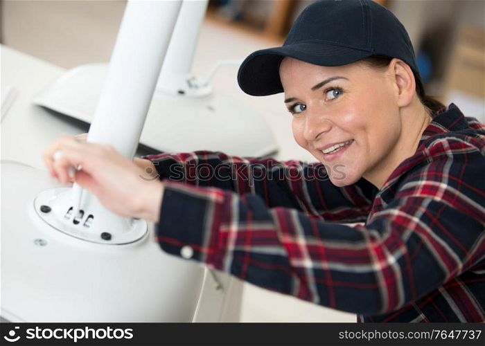 female contractor repairing a chair