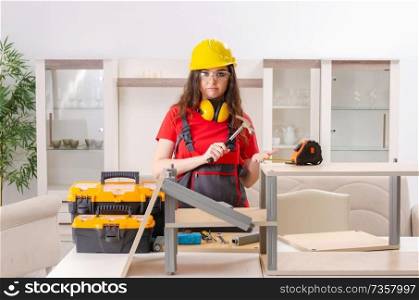 Female contractor repairing furniture at home 