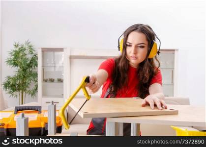 Female contractor repairing furniture at home 