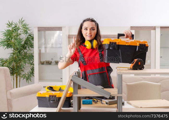 Female contractor repairing furniture at home 