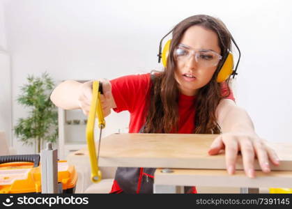 Female contractor repairing furniture at home 