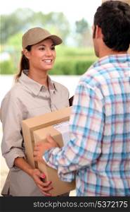 Female courier delivering package