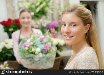 female customer buying some flowers