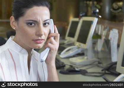 Female customer service representative talking on the telephone
