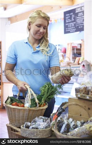 Female Customer Shopping In Farm Shop