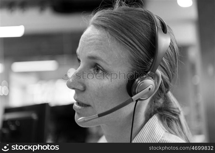 female customer support phone operator with headset at workplace