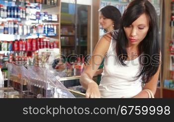 Female Customers Buying Beauty Care Products in Cosmetics Store