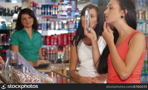 Female Customers Buying Beauty Care Products in Cosmetics Store, Testing Makeup Foundation