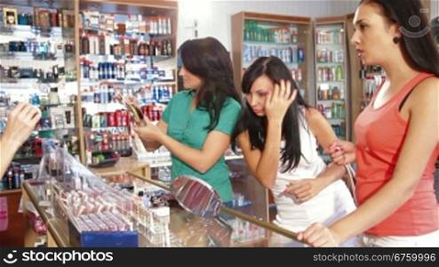 Female Customers Choosing Hair Dye in Beauty Department