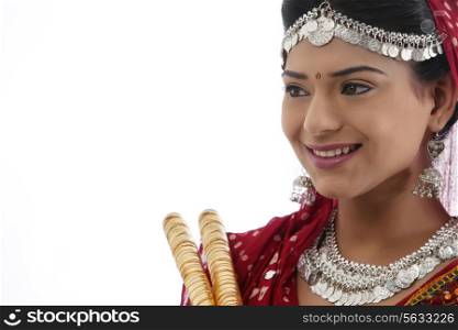 Female dandiya dancer with sticks