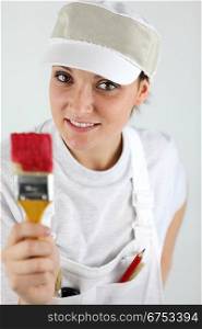 Female decorator holding paint brush
