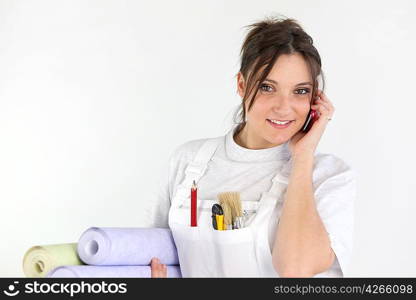 Female decorator taking a call
