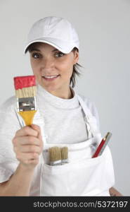 Female decorator with a paint brush