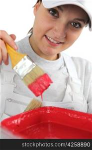Female decorator with red paint