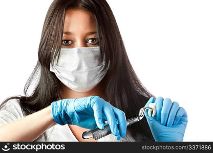 female dentist in mask holding forceps and tooth isolated