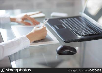 Female designer using graphics pad