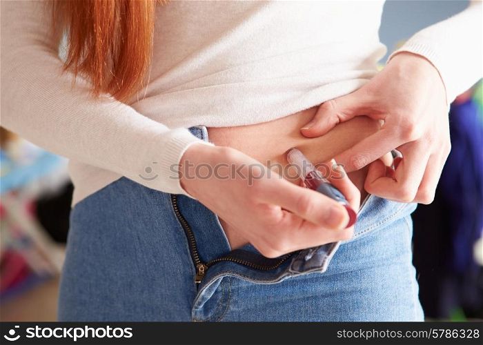 Female Diabetic Injecting Themselves With Insulin