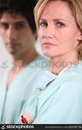 female doctor and his colleague with a serious air