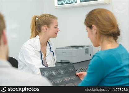 female doctor and patient discuss xray