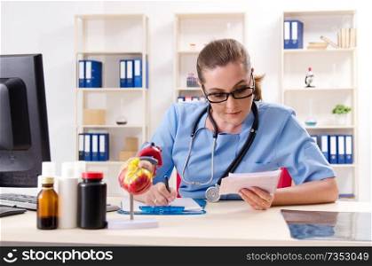Female doctor cardiologist working in the clinic 