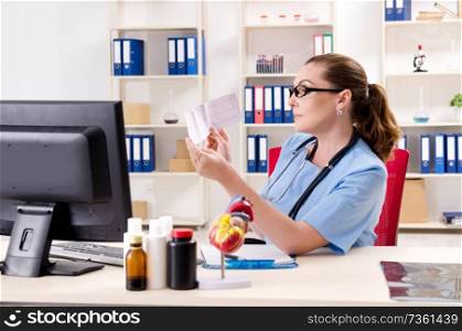 Female doctor cardiologist working in the clinic 
