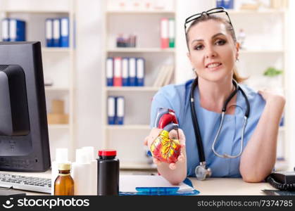 Female doctor cardiologist working in the clinic 