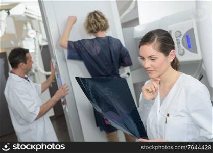female doctor checking xray