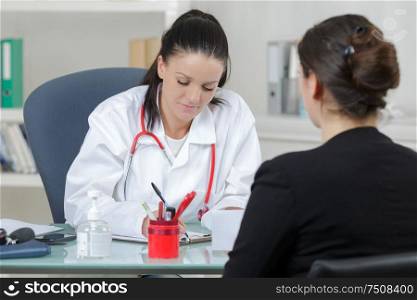 female doctor diagnose her patient