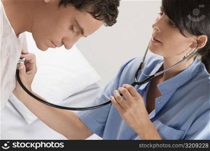 Female doctor examining a mid adult man