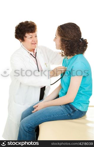 Female doctor examining a teenage girl, listening to her heartbeat with a stethoscope. Isolated.