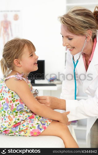 Female doctor examining child