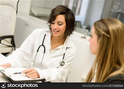 Female doctor explaining diagnosis to her female patient
