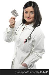 Female doctor handing medicine isolated on white
