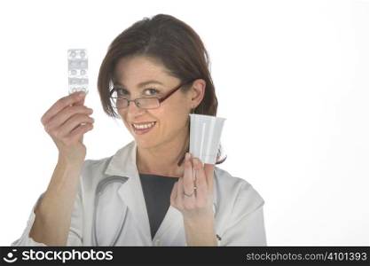 Female doctor handing over medicine isolated on white