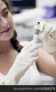 Female doctor holding a syringe