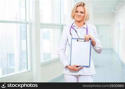female doctor holding empty clipboard